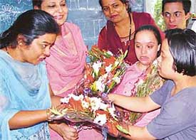 Mentally challenged students of the special cell of Bhavan Vidyalaya, Sector-27, present a bouquet to their teacher on Teachers Day