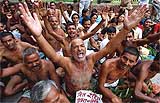 Members of the Bihar Pradesh Secondary Teachers Association raise slogans