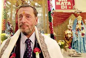 Britains Home Secretary David Blunkett wears a ceremonial tilak on his forehead during his visit to the Shri Ram Mandir in Southall