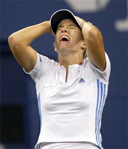Justine Henin-Hardenne of Belgium celebrates after winning her semifinal match against Jennifer Capriati of the US