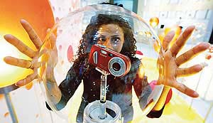 A model displays a Sony DSC-P8 digital camera ahead of the worlds largest international broadcasting fair Internationale Funkausstellung (IFA) in Berlin.