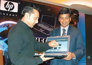 Film personality Rahul Bose and Hewlett-Packard India vice-president Ravi Swaminathan at the launch of companies new wireless notebook, HP nx9000 in New Delhi. 