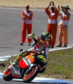Valentino Rossi of Italy rides his Honda GP after winning the Portuguese Grand Prix 
