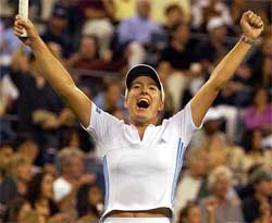 Justin Henin-Hardenne of Belgium celebrates her win over compatriot Kim Clijsters 