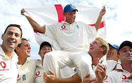England cricketer Alec Stewart is hoisted above by his teammates on a victory lap after defeating South Africa in the fifth Test 