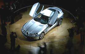 Visitors surround Mercedes Benz's McLaren SLR sports car at the International car show 