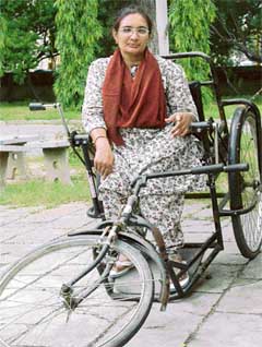 Urmil whose tricyle was damaged by campaigners