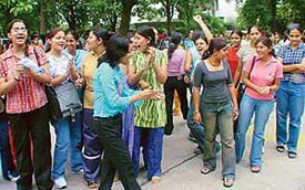 Students of MCM DAV College, Sector 36, protest outside the college campus in Chandigarh on Thursday.