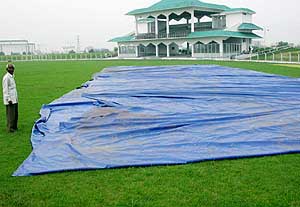 The tarpaulin pitch cover lying in the open