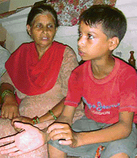 Rakesh with his mother after he returned home at Kumbra village on Saturday.