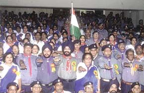 The Chairman of the All India Anti-Terrorist Front, Mr M. S. Bitta, administering the oath to Scouts and Guides to fight terrorism