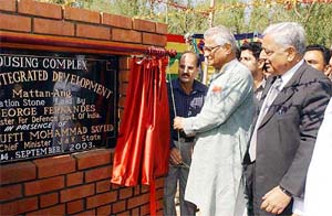 Defence minister George Fernandes unveils the foundation stone of a housing complex for Kashmiri pandit migrants at Mattan