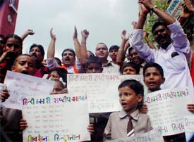 Schoolchildren and Shiv Sena activists take out a protest rally against the Principal of a local school