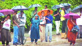 Umbrellas are out in all colours following incessant rain in the Capital on Sunday.