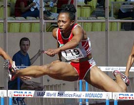Gail Devers of the US clears a hurdle on her way to win the women's 100m hurdles at the IAAF World Athletics Final 