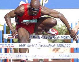 Allen Johnson of the US clears a hurdle on his way to win the men's 110m hurdles at the IAAF World Athletics Final