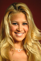 Russian tennis player Anna Kournikova takes to the ramp to display jewellery for a luxury brand, in Taipei