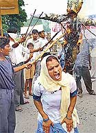 Activists of the Valmiki Chetna Parishad, Chandigarh, burn an effigy of the Chandigarh Police