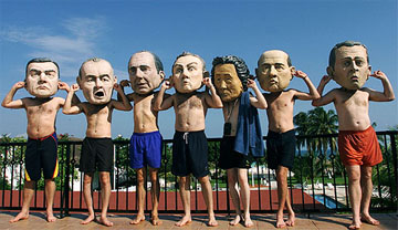 Members of Oxfam, a British NGO, lampoon leaders of the G8 countries