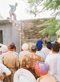 Demolition being carried out at Aiyali Kalan village in Ludhiana district