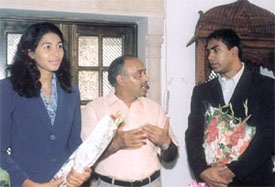 Anju Bobby George, who won a long jump bronze medal in the World Athletic Championship in France, and her husband with Minister of State for Youth Affairs and Sports Vijay Goel