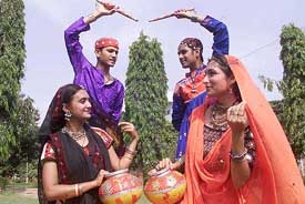 NRI members of Samarpan Academy of Dubai perform traditional Gujrati Matki Garba dance at a rehearsal for the forthcoming 'Navratri' festival