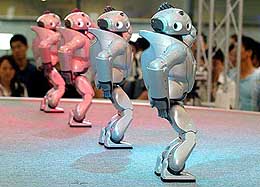 Sony's small biped entertainment robots called 'Qrio' perform dance