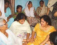Relatives mourn the death of Neelam Taneja who was murdered in Ludhiana on Friday.