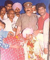 Mr Sita Ram, a former SSP, Batala, blesses Satwinder Singh Tommy, a police cat, at his marriage ceremony in 1989