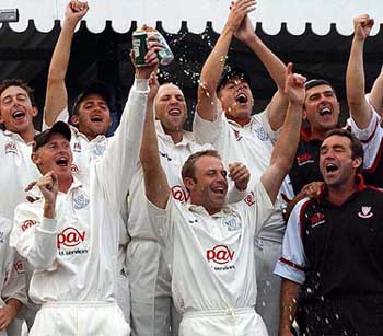 Sussex captain Chris Adams leads the celebrations with his team-mates on Thursday 