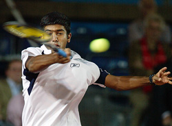 Rohan Bopanna of India hits a forehand to Martin Verkerk from the Netherlands 