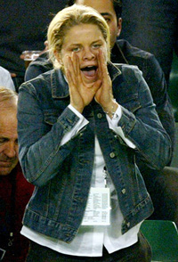 Top women's tennis player Kim Clijsters from Belgium, who's also the girlfriend of Australias Lleyton Hewitt, shouts to encourage Australias Mark Philippoussis 