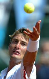 Spains Juan Carlos Ferrero serves to Argentinas Gaston Gaudio 