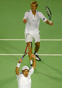 Australias Todd Woodbridge and Wayne Arthurs celebrate their victory over Switzerlands Roger Federer and Marc Rosset 