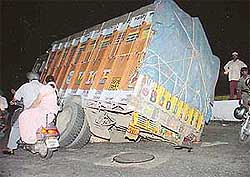 A loaded truck that got stuck in a pit