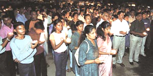 Residents of Delhi hold candles for peace outside the Sacred Heart Cathedral in the Capital on Sunday.