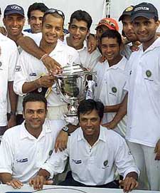Members of Rest of India pose with the Irani Trophy after beating Ranji champions Mumbai in Chennai 