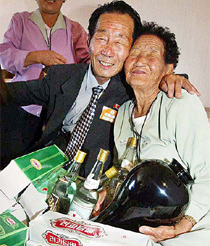 Chang lk-sung from North Korea and his South Korean sister Chang Ik-soon rejoice as they exchange presents at a resort in North Korea 