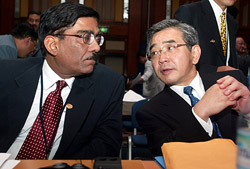Indian Secretary of Economic Affairs Dinesh Gupta listens to Zembei Mizoguchi
