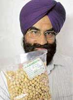 Mr B.S. Sethi, a resident of Shivalik Cooperative House Building Society, shows a packet of white gram purchased from a department store in Sector 34 that was full of pests. 