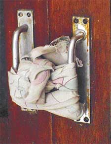 A door handle tied with cloth by the robbers