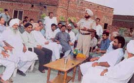 SHO Buland Singh addresses residents during a public-police meet
