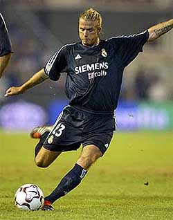 Real Madrid's David Beckham scores against Malaga during their Spanish league match 