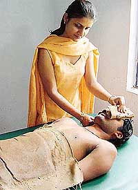 Dr Bindu Gupta gives mud therapy to a patient at the Nature Cure Centre at Kalagram, Mani Majra, 