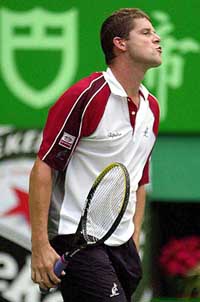 Jiri Novak of the Czech Republic reacts after defeating Dennis Van Scheppingen of Netherlands