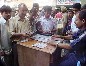Fortune seekers mill around a lottery vendor at Clock Tower in Ludhiana