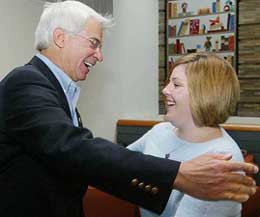 Elizabeth Jordan Carr, Americas first test tube baby, now 21 and a senior at Simmons College, embraces her birth delivery doctor Fredrick Wirth of King Prussia