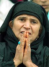 A Kashmiri Muslim woman offers prayers during Meraj-ul-Alam