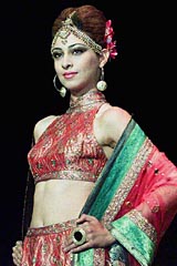 A model wears an outfit created by designer Ritu Kumar 
