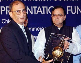 Union Minister of Commerce & Industry and Law & Justice Arun Jaitley presents the "All India Trophy for Top Exporters" to T. Mukherjee, Deputy Managing Director of Tata Iron & Steel company 